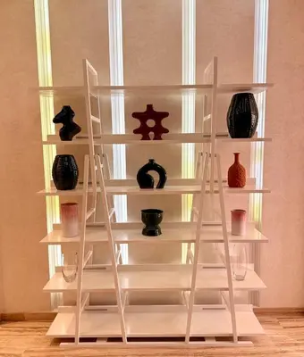 a shelving unit with vases and vases on it at Vibrant Modern House, 20 Min from Gueliz & Airport in Marrakech