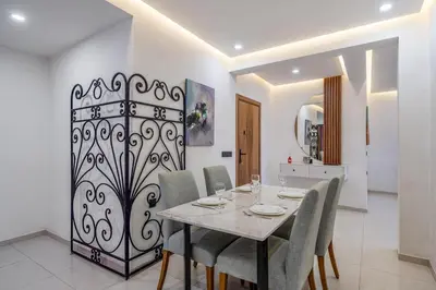 a dining room with a table and chairs at Modern 3-Bed retreat in Gueliz near Train station in Marrakech