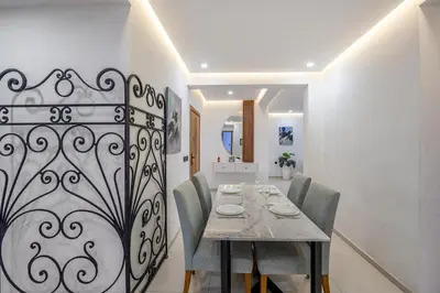 a dining room with a table and chairs at Modern 3-Bed retreat in Gueliz near Train station in Marrakech