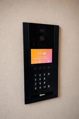 a cell phone is attached to a wall at Syra House Residence Moderne 2 Piscine Jacuzzi Parking in Marrakech