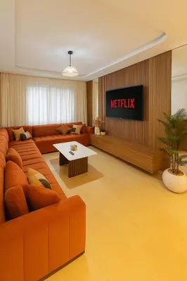 a living room with a couch and a television at Syra House Residence Moderne 2 Piscine Jacuzzi Parking in Marrakech
