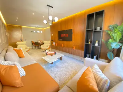a living room with a couch and a table at Hermès home in Marrakech