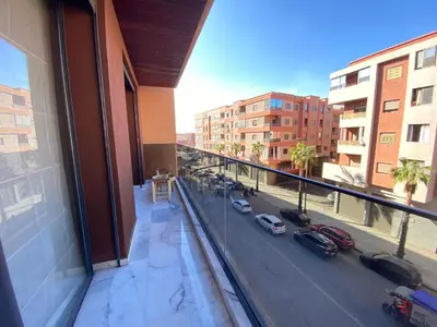 a view of a city street from a building at Hermès home in Marrakech