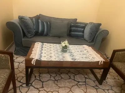 a living room with a couch and a coffee table at Espacieuse in Marrakech