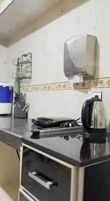 a kitchen counter with a toaster on top of a stove at Espacieuse in Marrakech