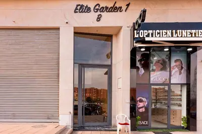 a store front with a white chair in front of it at Quiet & Secure Apt - Fast WiFi - Central Area in Marrakech