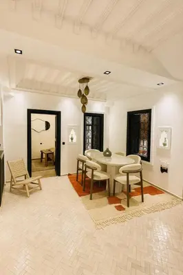 a dining room with a table and chairs at Riad chic Suite élégante au coeur de Marrakech in Marrakech