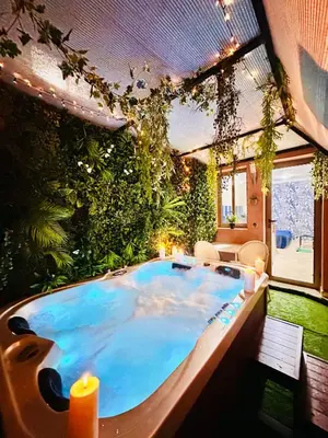 a large hot tub in a room with plants at Majorelle blue SPA retreat in Marrakech