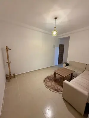 a living room with a couch and a table at Atlas view in Marrakech