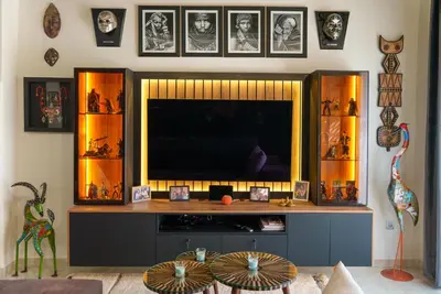 a entertainment center with a television in a living room at Eden Palmyra in Marrakech