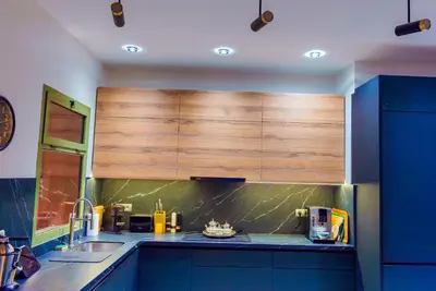 a kitchen with a sink and a wooden cabinet at Eden Palmyra in Marrakech