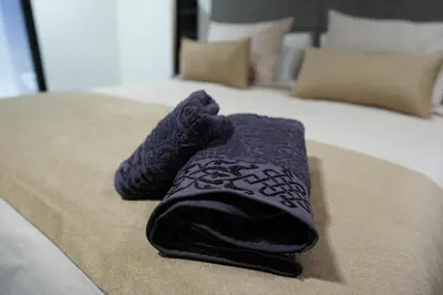 a purple towel sitting on top of a bed at The ApexYour skyward sanctuary in the city's heart in Marrakech