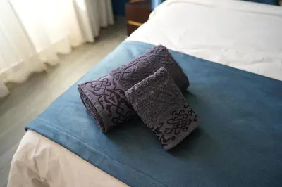 two pillows sitting on top of a bed at The ApexYour skyward sanctuary in the city's heart in Marrakech