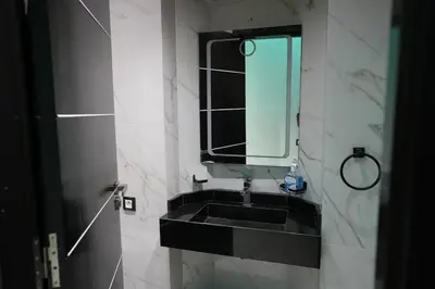 a bathroom with a black sink and a mirror at The ApexYour skyward sanctuary in the city's heart in Marrakech