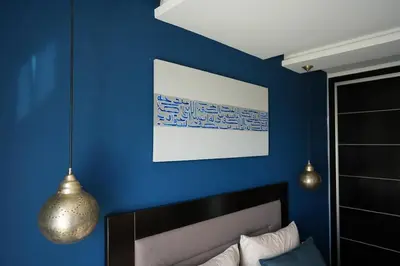 a blue room with a bed and a blue wall at The ApexYour skyward sanctuary in the city's heart in Marrakech