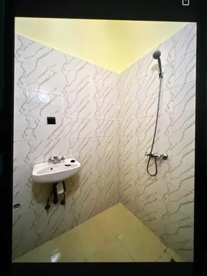a bathroom with a sink and a shower at Hôtel Zagora sur in Marrakech