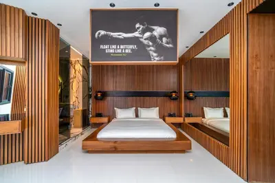 a bedroom with a bed and a poster on the wall at Luxury Apartment in Central Hivernage in Marrakech