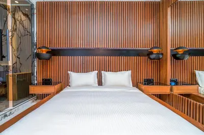 a bedroom with a large bed in a room at Luxury Apartment in Central Hivernage in Marrakech