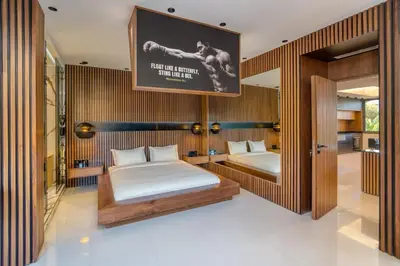 a bedroom with two beds and a poster on the wall at Luxury Apartment in Central Hivernage in Marrakech