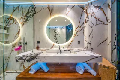 a bathroom with a sink and a mirror at Luxury Apartment in Central Hivernage in Marrakech