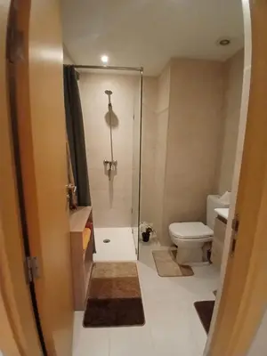 a bathroom with a shower and a toilet at Studio meublé Guéliz in Marrakech