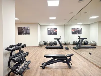 a gym with several exercise equipment in a room at Luxury Studio Guéliz Pools, Jacuzzi Fitness in Marrakech