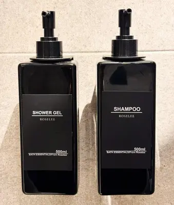 two bottles of shampoos sitting next to each other at New Apartment in Gueliz with Private Terrace in Marrakech