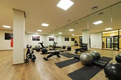 a gym with exercise balls and pilates equipment in a room at New Apartment in Gueliz with Private Terrace in Marrakech