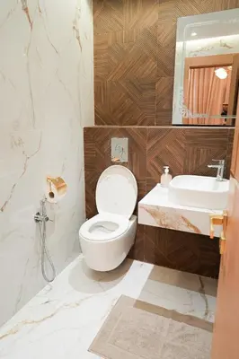 a bathroom with a toilet and a sink at The Skybox your private seat at the city s show in Marrakech