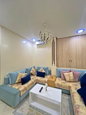 a living room with a couch and a table at Garden Apartment 5 min from Gueliz in Marrakech