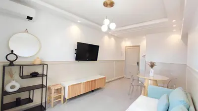 a living room with a couch and a table at A cozy escape in Marrakech in Marrakech