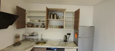 a kitchen with a sink and a refrigerator at Light filled Urban Retreat in Marrakech