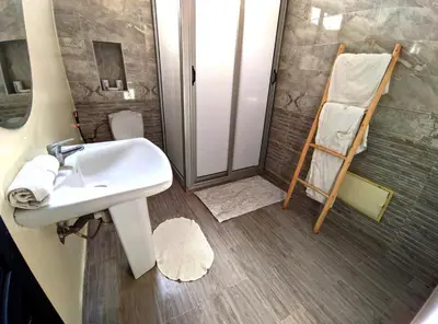 a bathroom with a sink and a shower at Villa Riad Dar Sukar in Marrakech