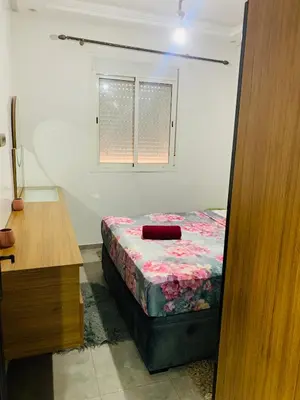 a small bedroom with a bed and a window at appartement lumineux parfait Cosy prêt de Guéliz in Marrakech