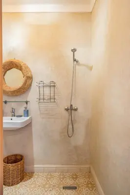 a bathroom with a shower and a sink at Riad Cherifa Breakfast and Jacuzzi Terrace in Marrakech