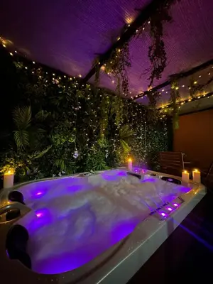 a bath tub with purple lights in a room at Majorelle Terracotta Spa in Marrakech