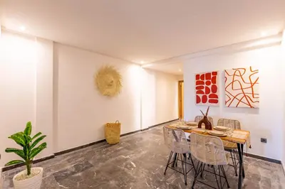 a dining room with a table and chairs at Marrakesh 2 BR Apartment in Marrakech
