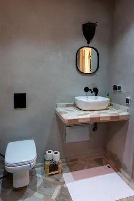 a bathroom with a sink and a toilet at Maison beldi loft in Marrakech