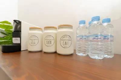 a group of bottles of water sitting on a table at Gueliz - Pool & Jacuzzi - Luxury Residence in Marrakech