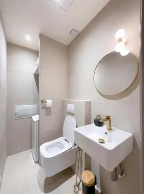 a bathroom with a sink and a toilet and a mirror at Modern & Luxurious Apartment, Terrace with panoramic view of Gueliz in Marrakech