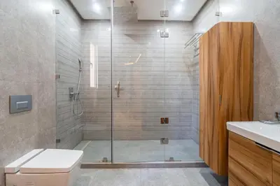a bathroom with a shower with a toilet and a sink at Villa luxe, tranquillité aux portes de Marrakech in Marrakech