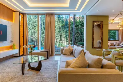 a living room with a couch and a table at Villa luxe, tranquillité aux portes de Marrakech in Marrakech