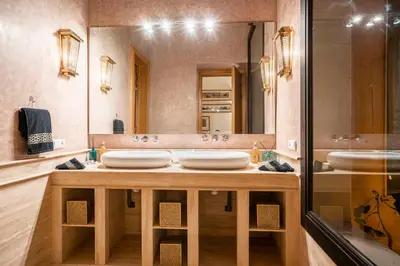 a bathroom with three sinks and a large mirror at Resort Batoul nor marrakech in Marrakech