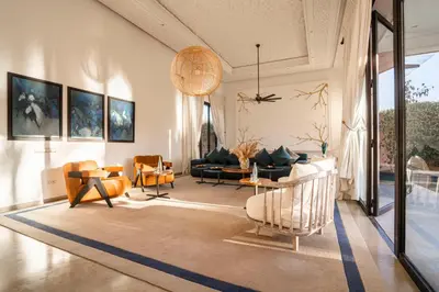a living room with a couch and a table at Resort Batoul nor marrakech in Marrakech