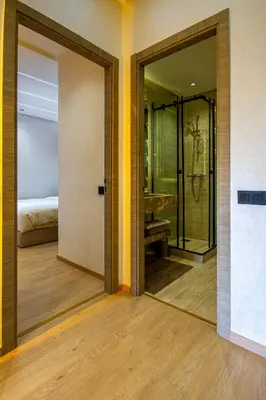 a bathroom with a glass door leading to a bedroom at Marrakech golf Prestigia Jade in Marrakech