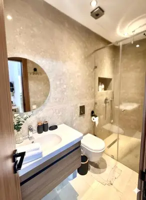 a bathroom with a sink and a toilet and a shower at Studio haut standing in Marrakech