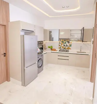 a kitchen with a refrigerator and a sink at Studio haut standing in Marrakech