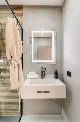 a bathroom with a white sink and a mirror at Studio Nahellan in Marrakech