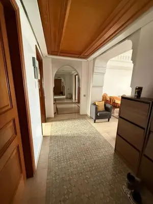 a living room with a couch and a chair at Central Gueliz 2Bedroom Apartment in Marrakech