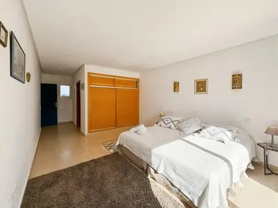 a white bedroom with a large bed in a room at Exceptional Villa Private Pool - Ourika Road in Marrakech